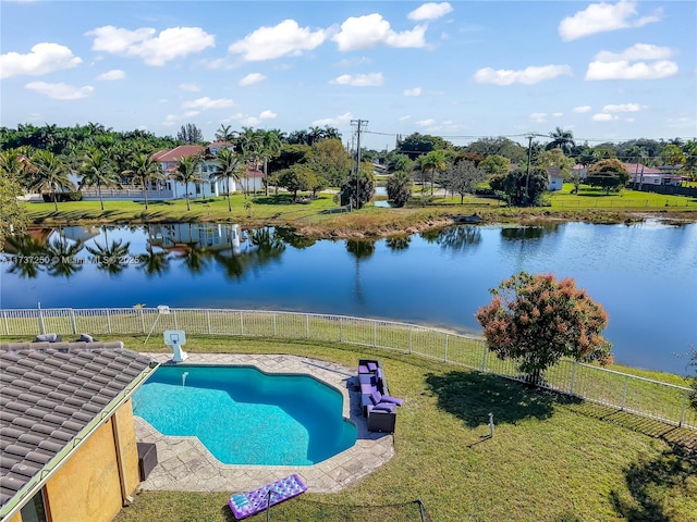 view of pool featuring a water view and a yard