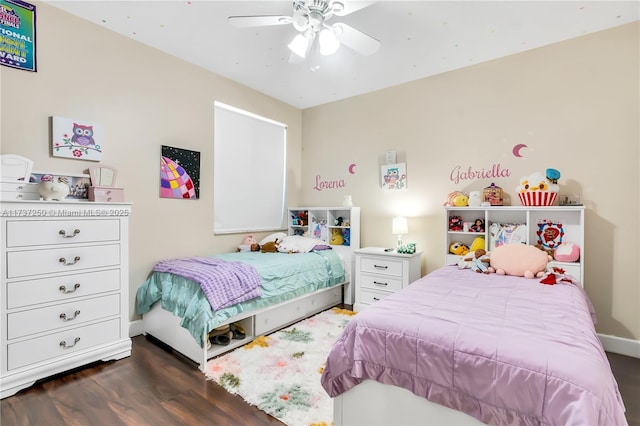 bedroom featuring dark wood-type flooring and ceiling fan