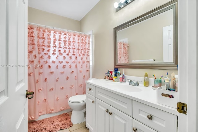 bathroom featuring vanity, a shower with curtain, tile patterned floors, and toilet