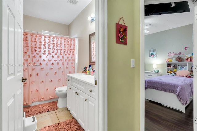 bathroom with vanity, tile patterned floors, toilet, and a shower with shower curtain