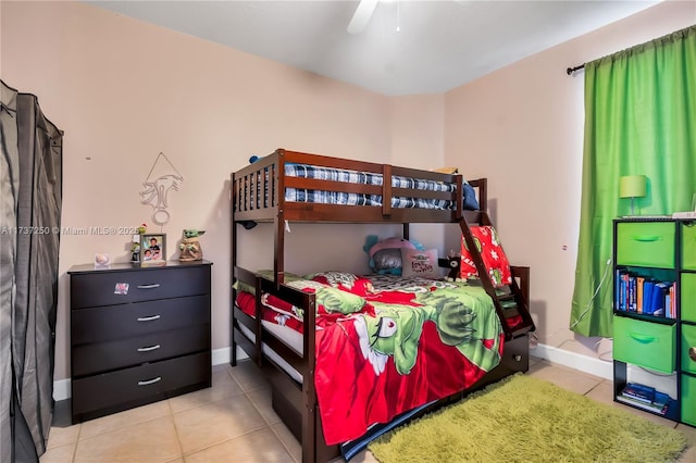 bedroom with ceiling fan and light tile patterned floors