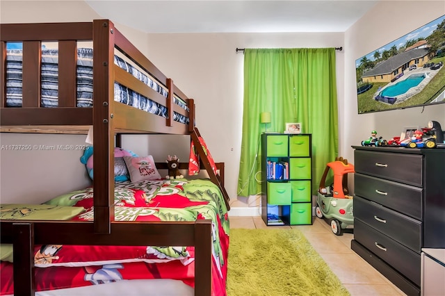 bedroom featuring light tile patterned flooring