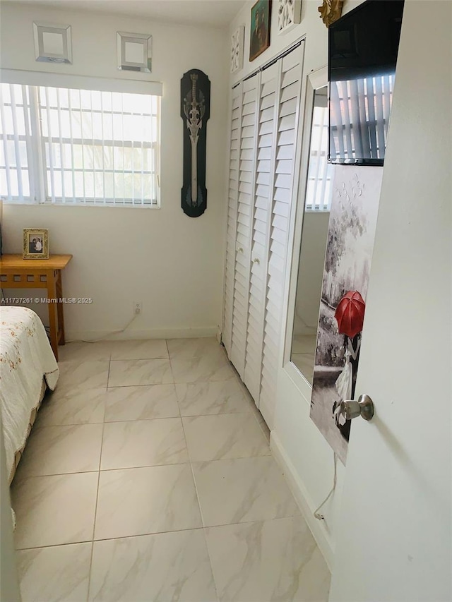 1333 E Hallandale Beach Blvd Unit 131, Hallandale Beach, FL 33009 - bathroom with a shower with door, vanity, tile patterned flooring, and toilet