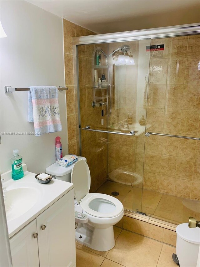 1333 E Hallandale Beach Blvd Unit 131, Hallandale Beach, FL 33009 - bathroom with vanity, toilet, and walk in shower