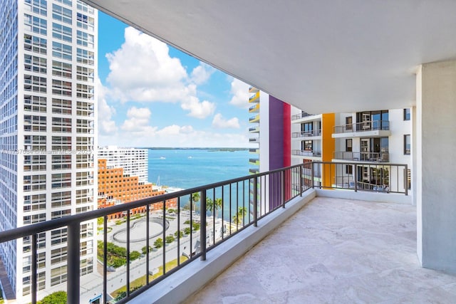 balcony featuring a water view