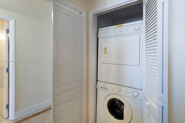 laundry area featuring stacked washer and dryer