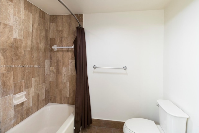 bathroom with shower / bathtub combination with curtain, tile patterned floors, and toilet