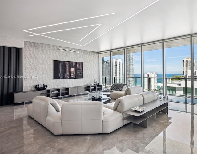 living room with expansive windows and a water view