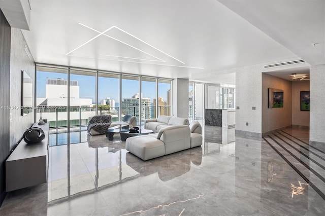 living room featuring a wall of windows