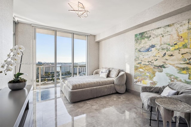 bedroom featuring access to outside and expansive windows