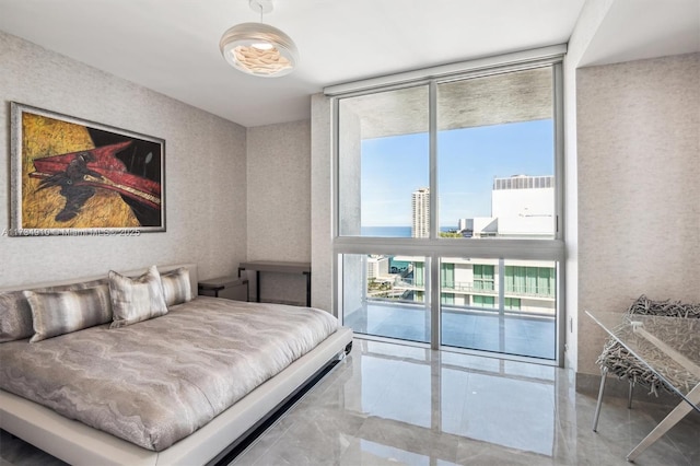 bedroom featuring floor to ceiling windows