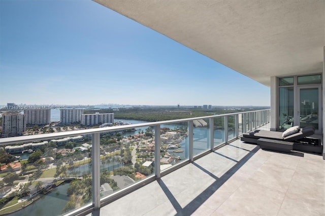 balcony featuring a water view