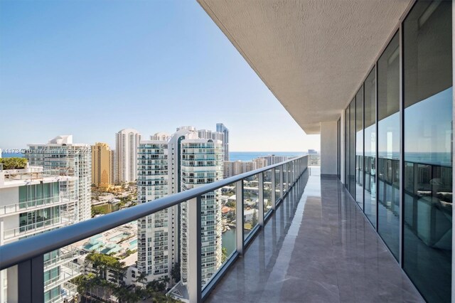 balcony featuring a water view