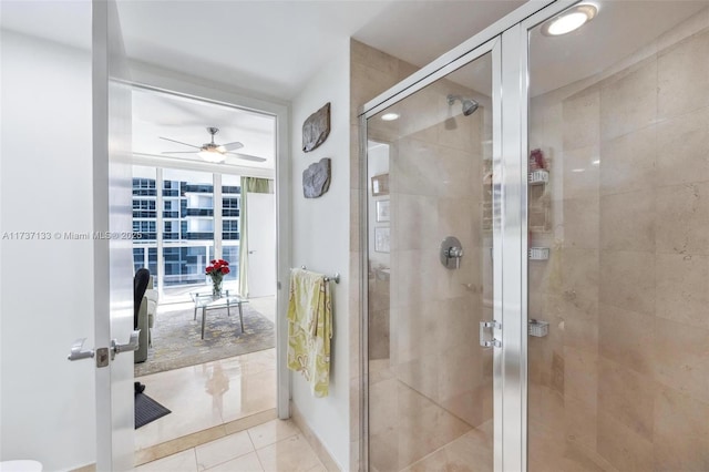 bathroom featuring tile patterned flooring, ceiling fan, and walk in shower