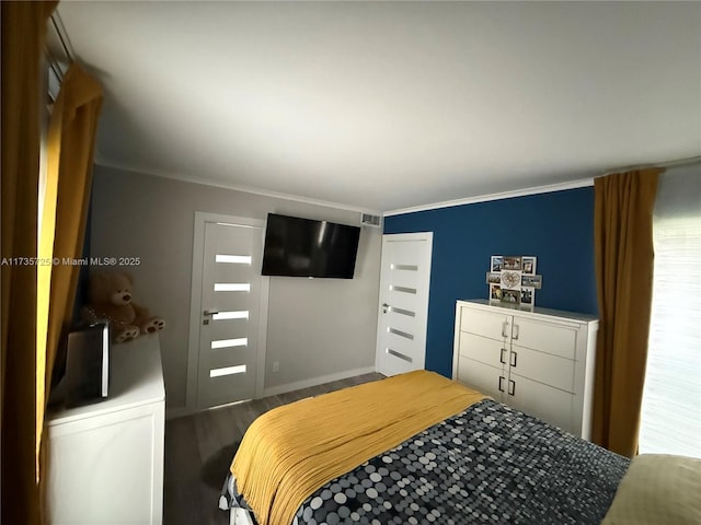 bedroom with wood-type flooring and ornamental molding