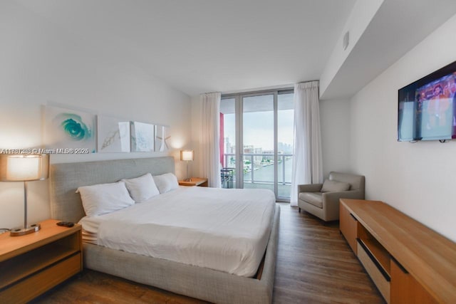 bedroom with expansive windows, a baseboard radiator, access to exterior, and dark hardwood / wood-style flooring