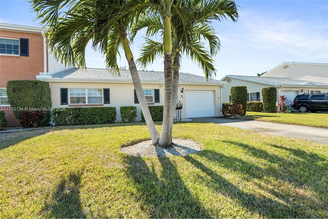 view of front of home with a garage and a front yard