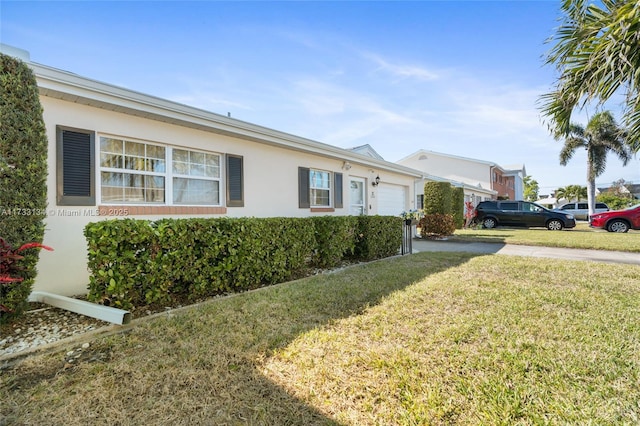 view of side of property with a lawn