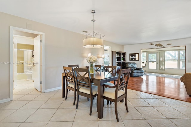 dining area with light tile patterned floors