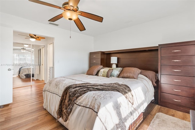 bedroom featuring ceiling fan and light hardwood / wood-style floors