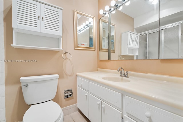 bathroom featuring vanity, tile patterned flooring, a shower with door, and toilet