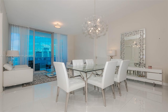 dining room featuring an inviting chandelier and tile patterned flooring