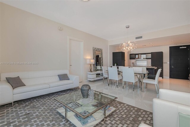 living room featuring a notable chandelier