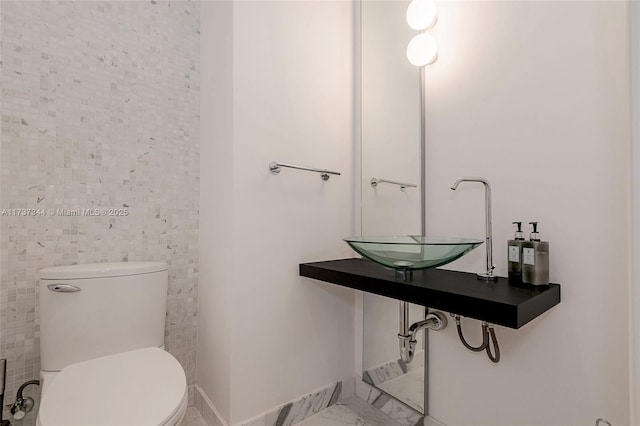 bathroom with sink and toilet