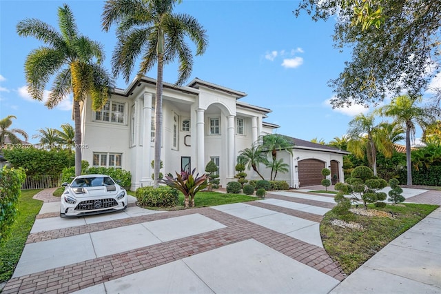 mediterranean / spanish house with a garage