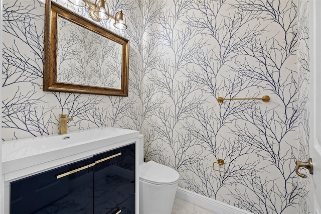 bathroom with vanity and toilet