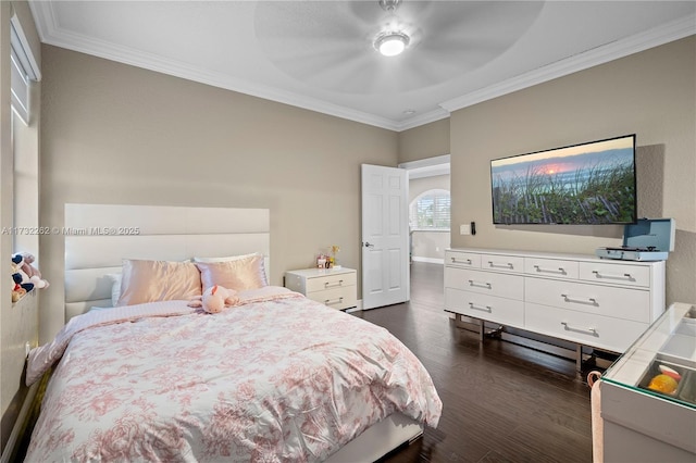 bedroom featuring ornamental molding, dark hardwood / wood-style floors, and ceiling fan