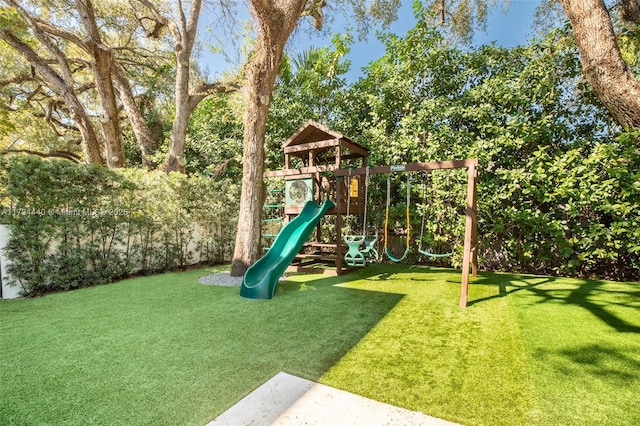 view of jungle gym with a lawn