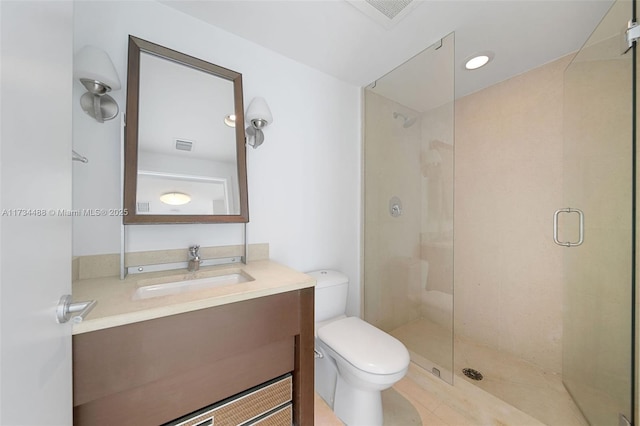 full bath featuring toilet, visible vents, a shower stall, and vanity