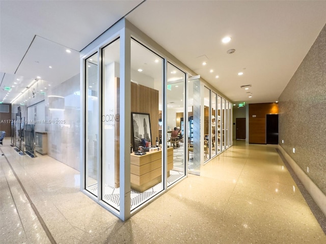 interior space with a wall of windows