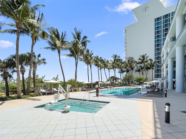 view of swimming pool featuring a patio area