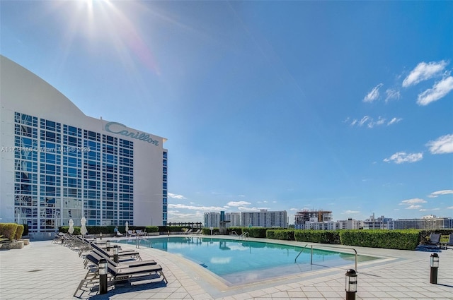 community pool featuring a patio area