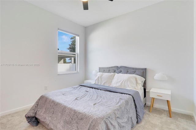 bedroom featuring light carpet and ceiling fan