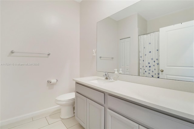 bathroom with a shower with curtain, vanity, toilet, and tile patterned flooring