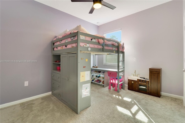 bedroom with ceiling fan and carpet floors