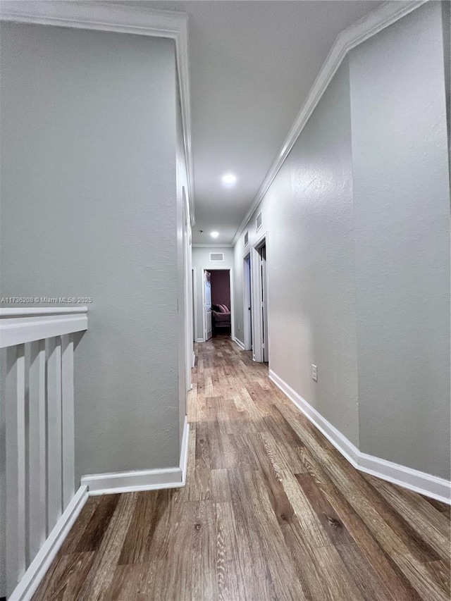 8654 W 33rd Ave, Hialeah, FL 33018 - hallway with wood finished floors, ornamental molding, and baseboards