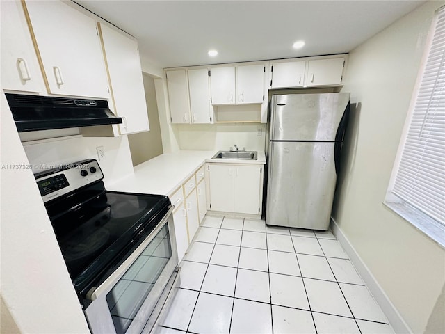 kitchen featuring stainless steel appliances, white cabinetry, sink, and light tile patterned floors