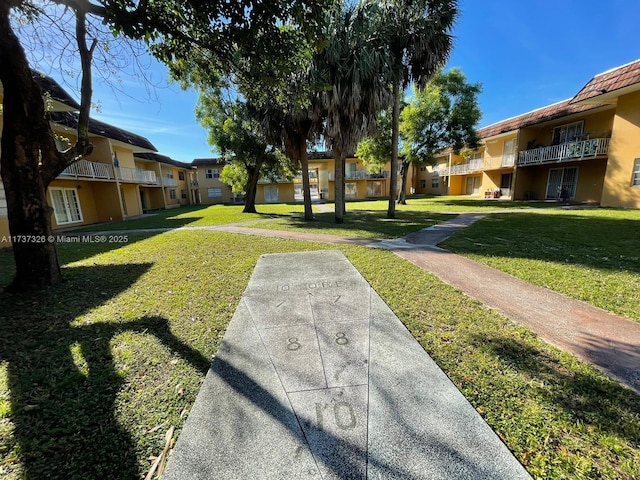 surrounding community featuring a lawn