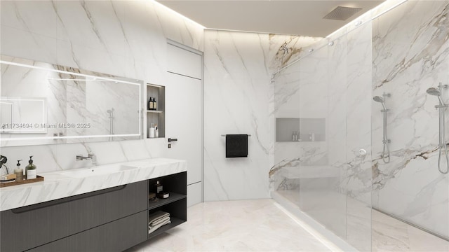 bathroom with vanity and a tile shower