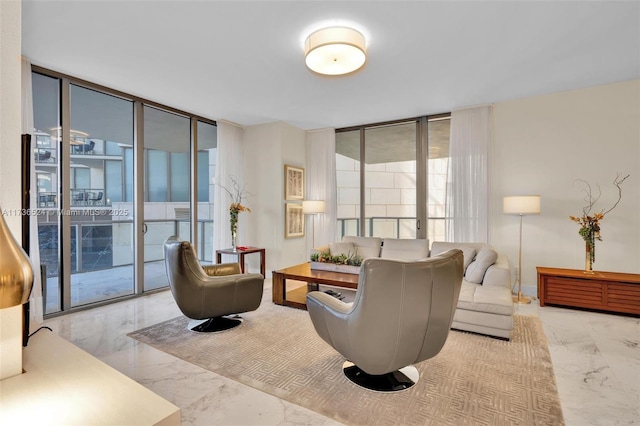 living room featuring floor to ceiling windows and french doors