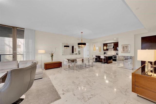 living room featuring an inviting chandelier