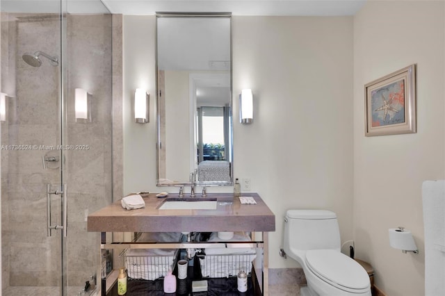 bathroom featuring an enclosed shower, sink, and toilet