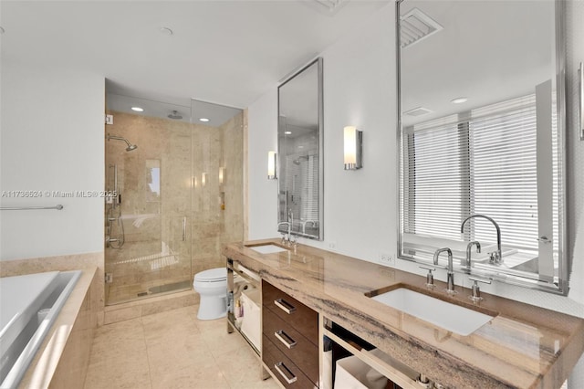 full bathroom featuring vanity, tile patterned floors, independent shower and bath, and toilet