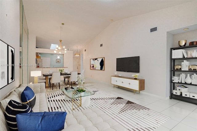 living room featuring high vaulted ceiling, light tile patterned floors, and a chandelier