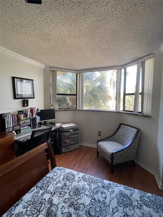 office area featuring crown molding, hardwood / wood-style floors, a textured ceiling, and a wealth of natural light