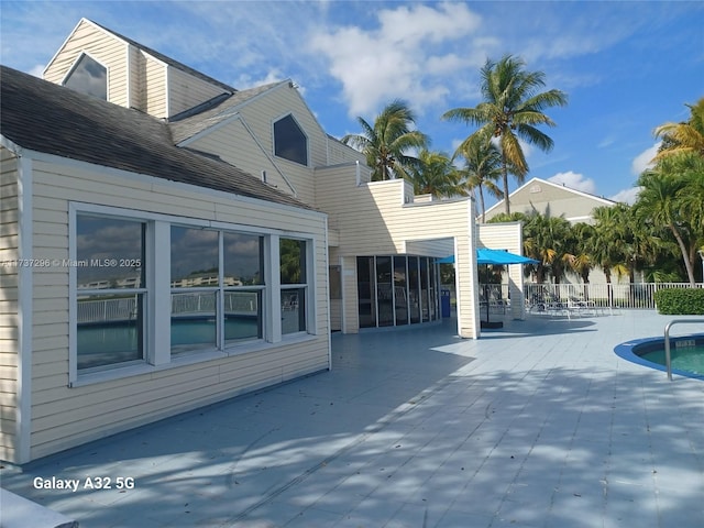 3437 NW 44th St Unit 102, Oakland Park, FL 33309 - view of swimming pool with a patio area